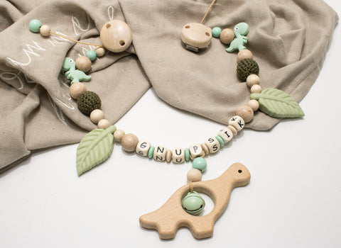 Kinderwagenkette Dino Dinosaurier oliv Natur Silikonperlen
