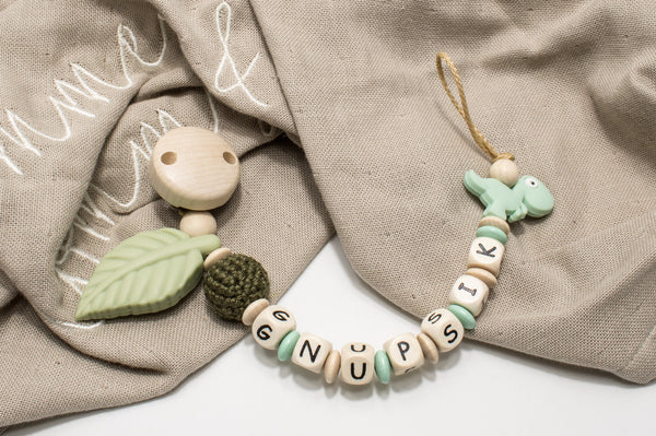 Dino Kinderwagenkette Wagenkette einzeln oder als Spar Set oliv/mint natur Holz Greifling